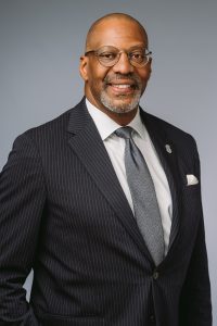 Headshot of Solicitor Byron Gipson against a gray backdrop.